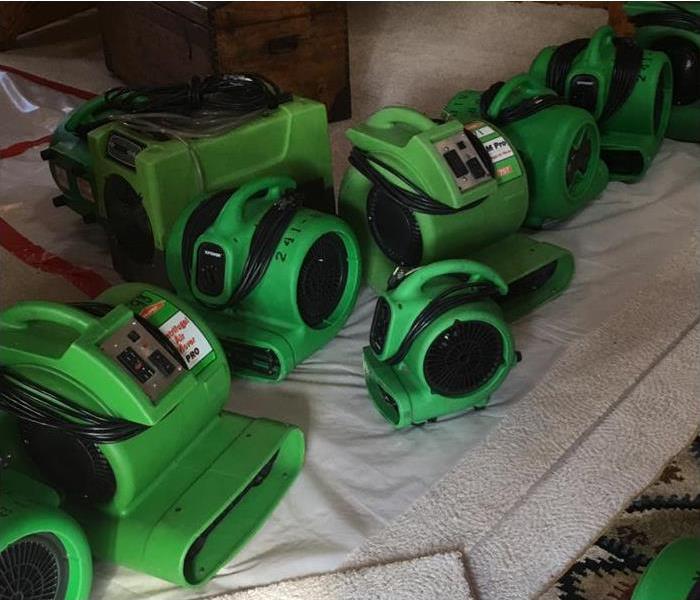 a pile of air movers on a carpet